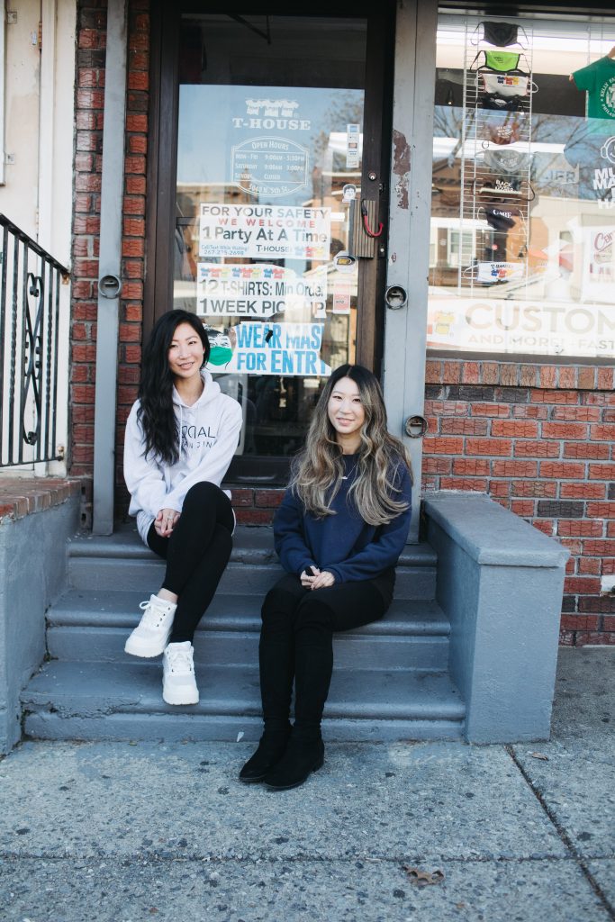 women sitting on steps welcoming